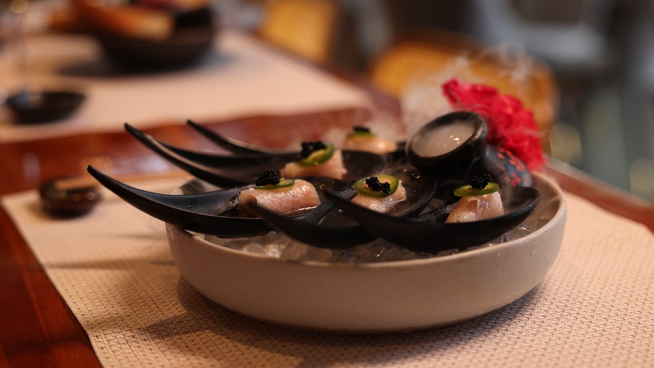 Yellowtail bites with jalapeño and caviar on black spoons, from the Lens Head Media restaurant reel